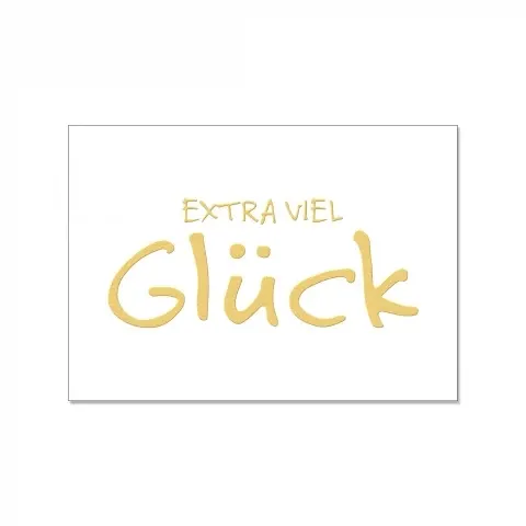 Weiße Postkarte mit der Goldenen Schrift "Extra viel Glück"