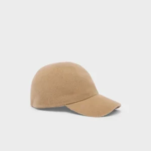 The Baseball Cap - Camel/Butter shown in a soft camel color with a smooth texture resembling cashmere, highlighting its minimalist and cozy design.