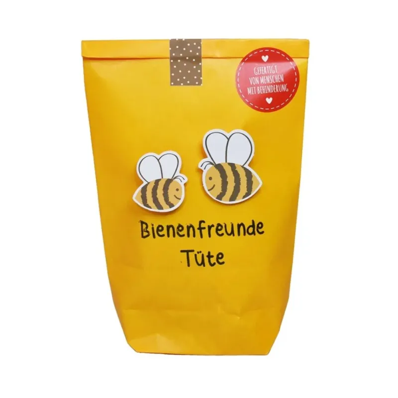 Gelbe Wundertüte mit der Schrift "Bienen Freunde Tüte" und zwei kleinen aufgeklebten Bienen